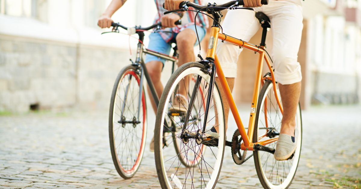 an image of two people on a bike.